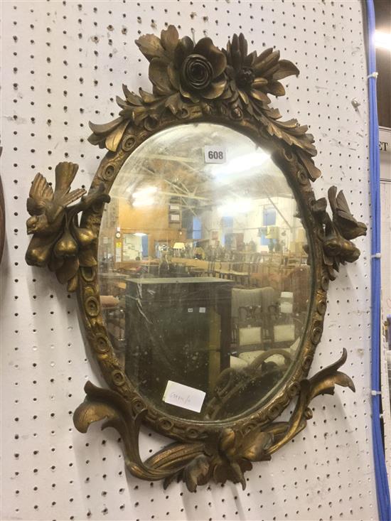 Carved gilt wood oval mirror